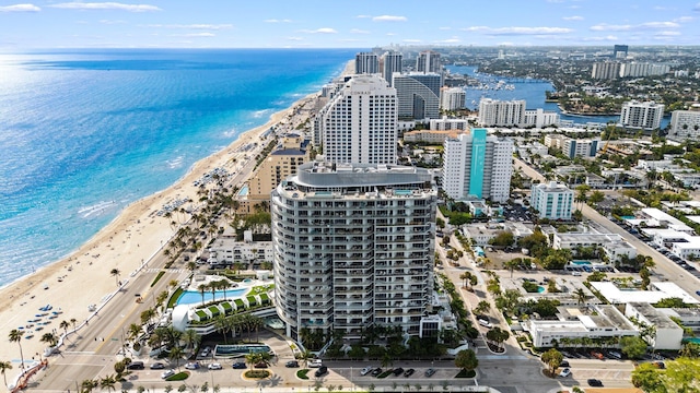 bird's eye view featuring a view of the beach, a view of city, and a water view