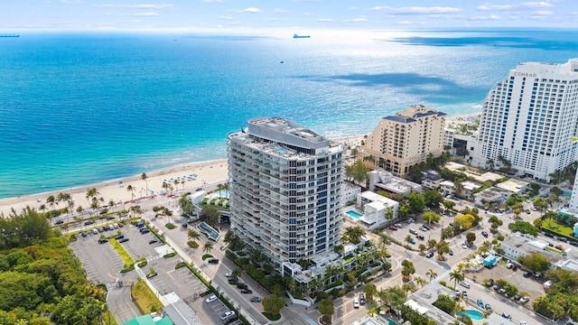 aerial view featuring a beach view, a view of city, and a water view