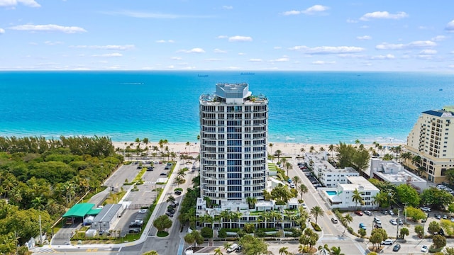 aerial view featuring a water view and a view of the beach