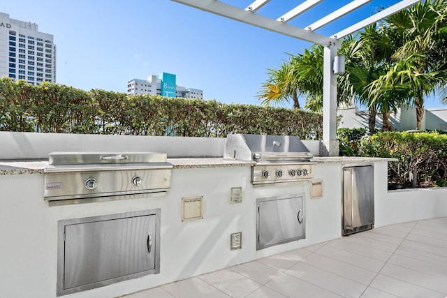 view of patio / terrace featuring area for grilling, a city view, a grill, and a pergola