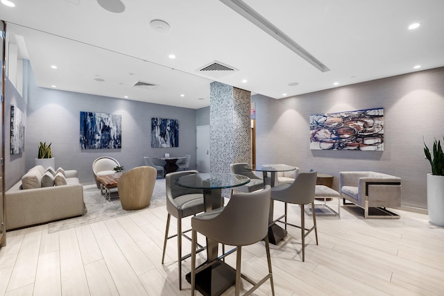 dining space featuring visible vents, recessed lighting, and light wood-style floors