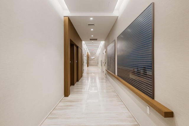 hallway with visible vents and recessed lighting