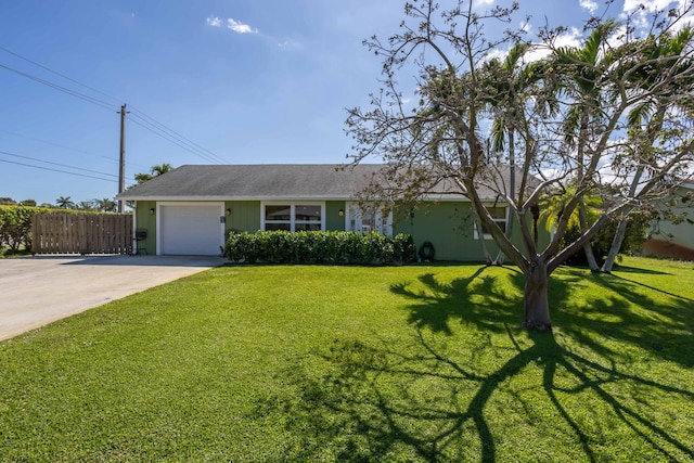 ranch-style house with a garage and a front yard