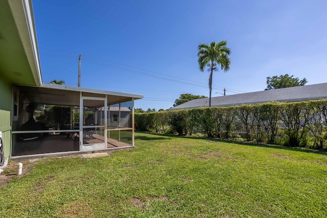 view of yard featuring a sunroom