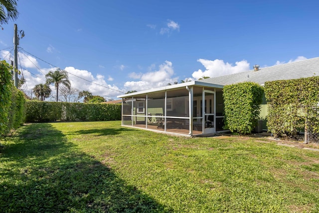 view of yard with a sunroom