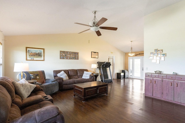 living room featuring ceiling fan, dark hardwood / wood-style floors, and vaulted ceiling