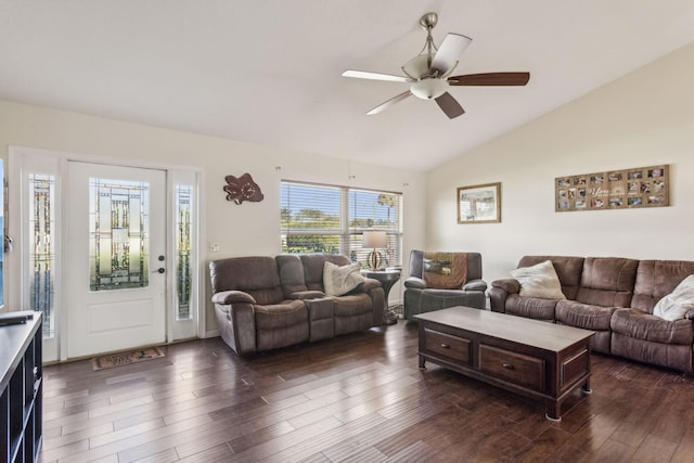 living room featuring dark hardwood / wood-style flooring, vaulted ceiling, and ceiling fan