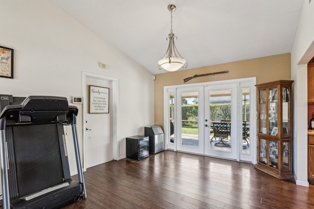 workout room with dark wood-type flooring, vaulted ceiling, and french doors