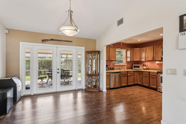 kitchen featuring decorative light fixtures, sink, stove, stainless steel dishwasher, and french doors