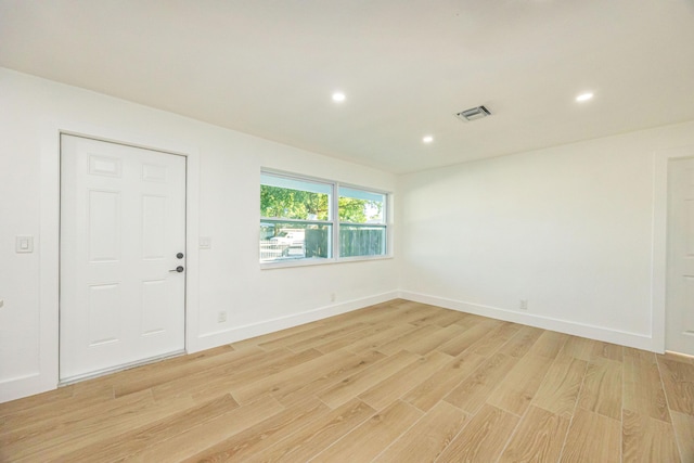 unfurnished room featuring light hardwood / wood-style flooring