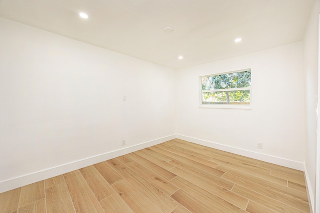 unfurnished room featuring hardwood / wood-style floors