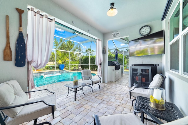 outdoor pool featuring a patio, a lanai, and a grill