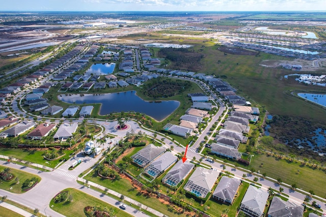 bird's eye view with a residential view and a water view