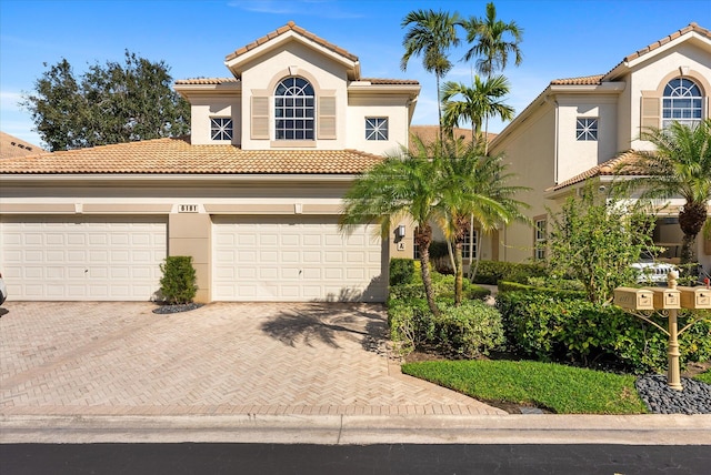 mediterranean / spanish house featuring a garage