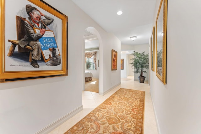 corridor with light tile patterned floors