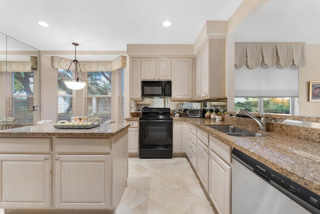 kitchen with sink, light tile patterned floors, pendant lighting, light stone countertops, and black appliances