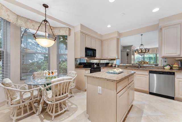 kitchen featuring pendant lighting, sink, a center island, light stone counters, and black appliances