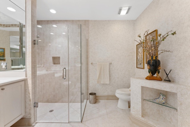 bathroom featuring vanity, an enclosed shower, tile patterned flooring, and toilet