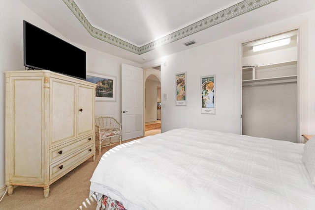 bedroom featuring light colored carpet