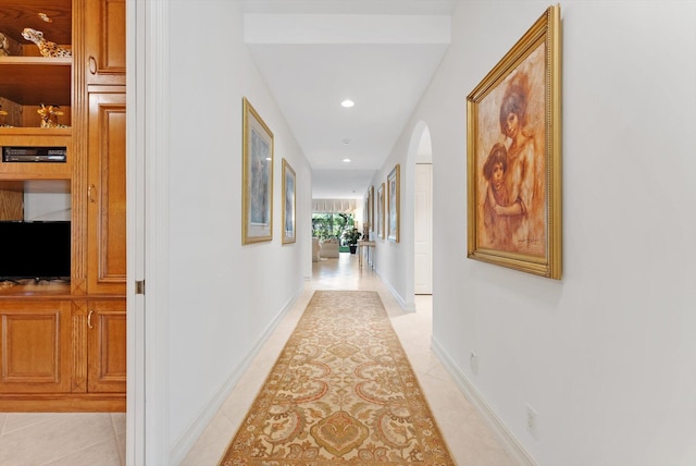 hallway with light tile patterned floors