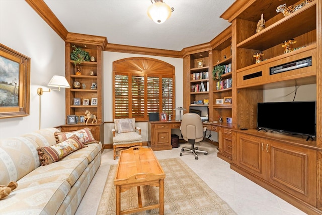 home office featuring crown molding, built in desk, light tile patterned floors, and built in shelves