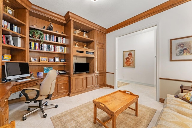 office area with crown molding, built in shelves, and light tile patterned floors