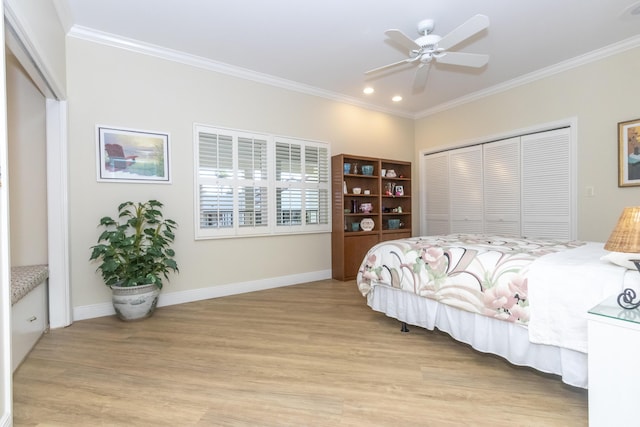 bedroom with light wood-type flooring, a closet, baseboards, and crown molding