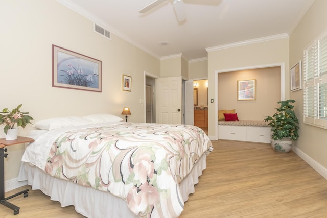 bedroom with baseboards, light wood-type flooring, visible vents, and crown molding