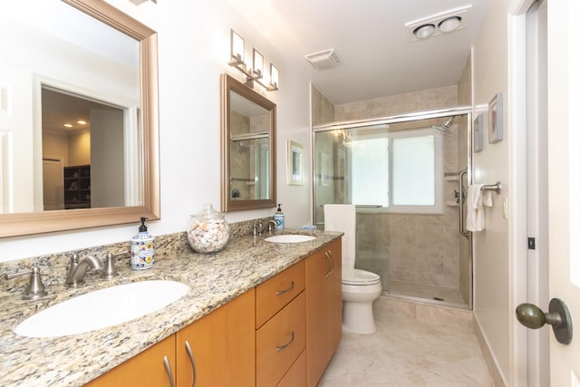 full bathroom with toilet, a stall shower, visible vents, and a sink