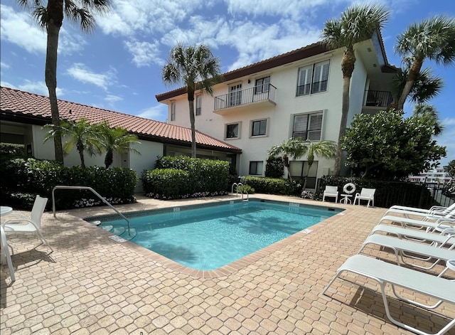 pool with a patio area