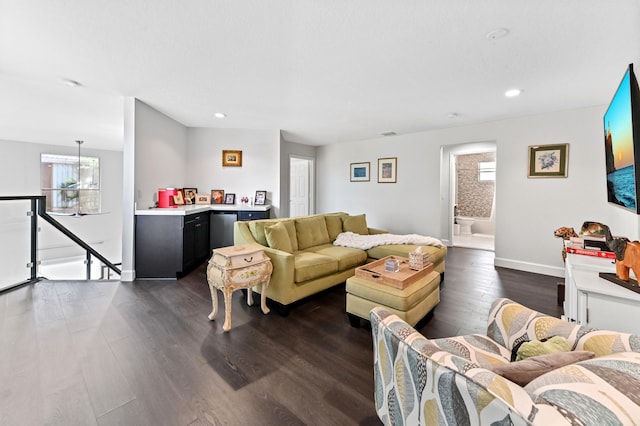 living room featuring recessed lighting, dark wood finished floors, and baseboards