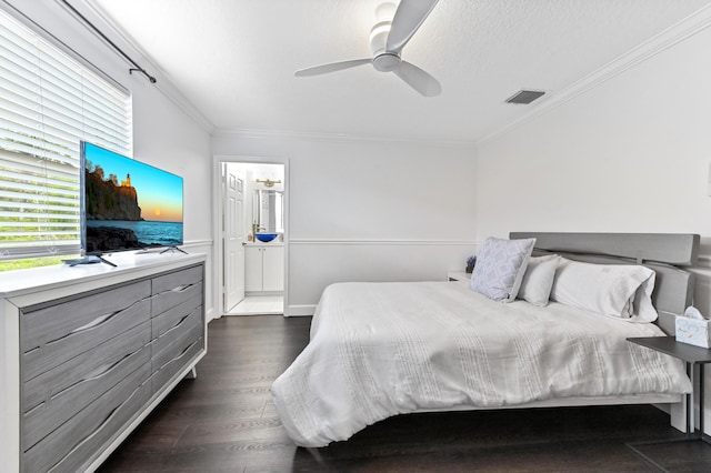 bedroom featuring a textured ceiling, visible vents, a ceiling fan, ornamental molding, and dark wood-style floors