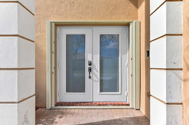 property entrance featuring french doors