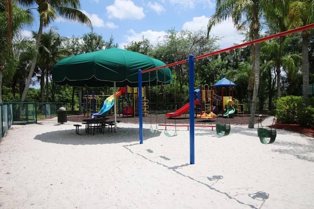 communal playground featuring fence