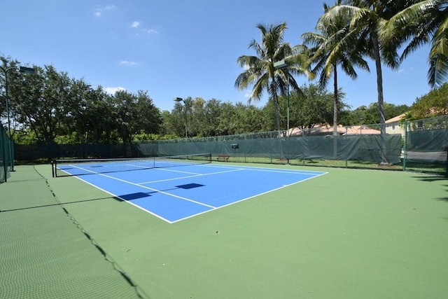 view of sport court with fence