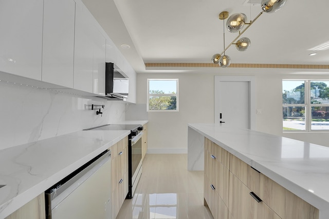 kitchen with dishwasher, white cabinets, hanging light fixtures, light stone counters, and electric stove