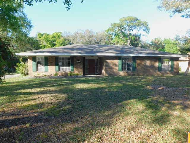 ranch-style house featuring a front lawn