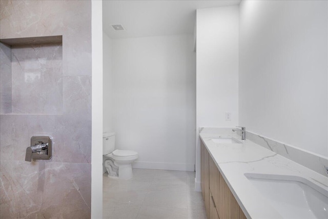 full bathroom with double vanity, visible vents, toilet, and a sink