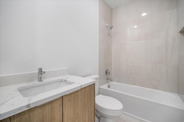 full bathroom with shower / washtub combination, vanity, and toilet