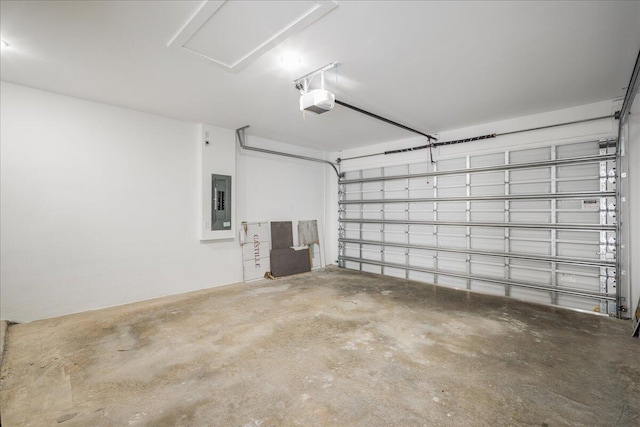 garage with electric panel and a garage door opener