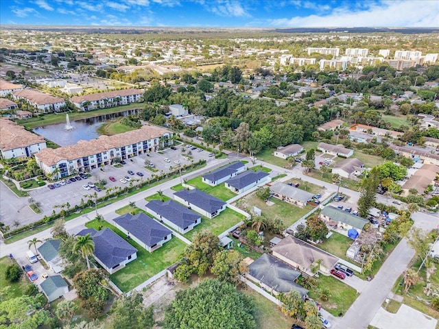 bird's eye view featuring a residential view and a water view