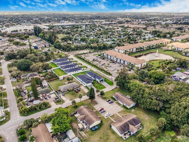 birds eye view of property with a residential view