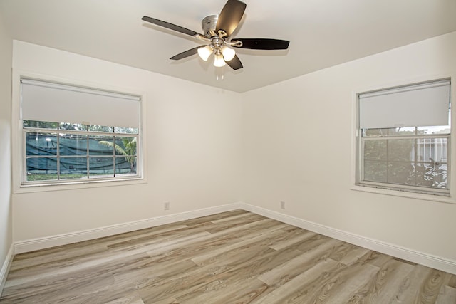 spare room with light hardwood / wood-style flooring and ceiling fan