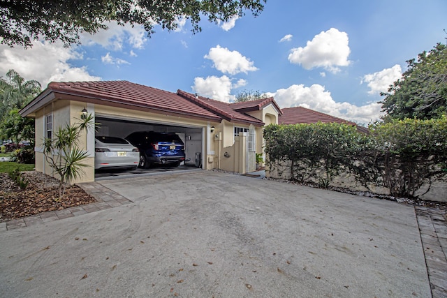 view of side of home with a garage