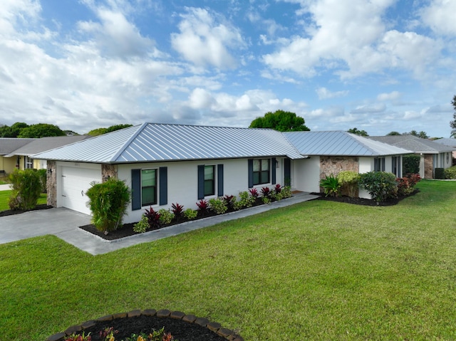 ranch-style home featuring a garage, concrete driveway, metal roof, a front lawn, and stucco siding