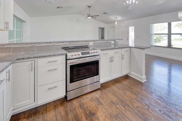 kitchen with dark wood-style flooring, visible vents, white cabinets, vaulted ceiling, and stainless steel range with electric cooktop