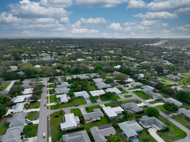 bird's eye view featuring a water view and a residential view