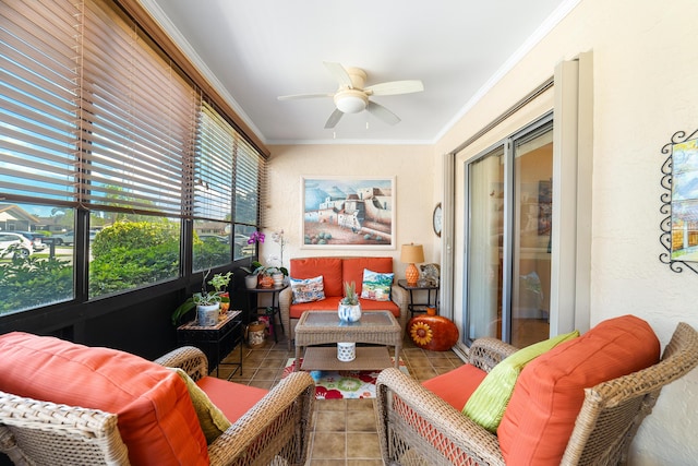 sunroom / solarium featuring ceiling fan