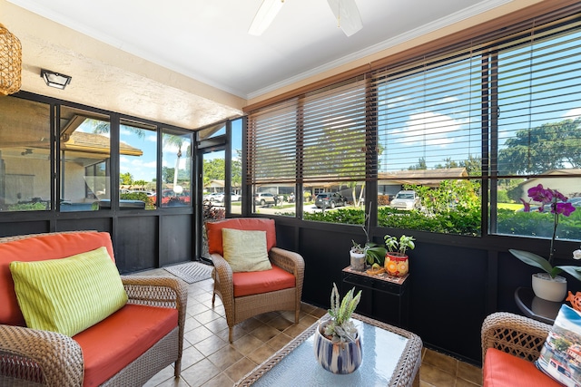 sunroom featuring ceiling fan