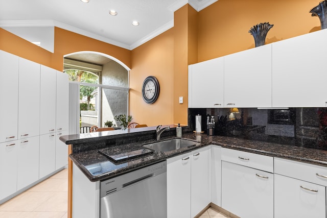 kitchen with white cabinetry, stainless steel dishwasher, and kitchen peninsula